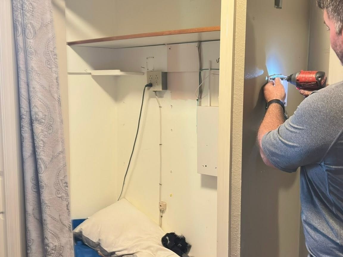 Built-in closet with a hanging rod still in place