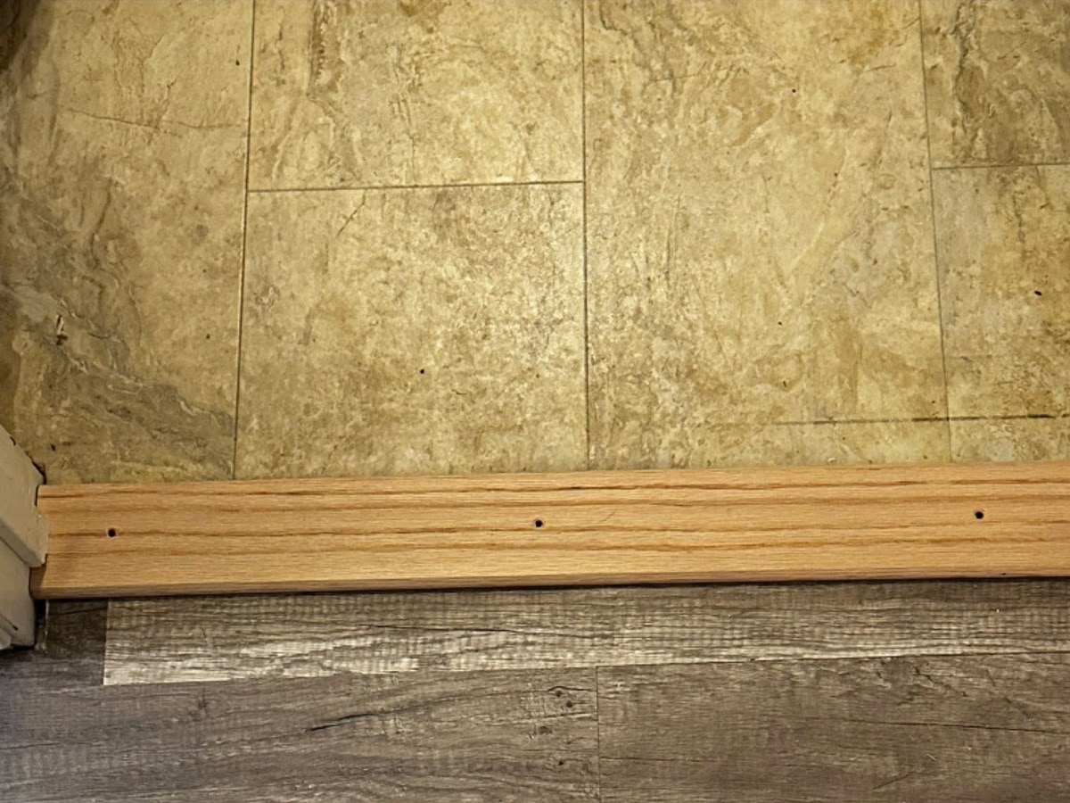 The same doorway after a transition strip was anchored into the concrete