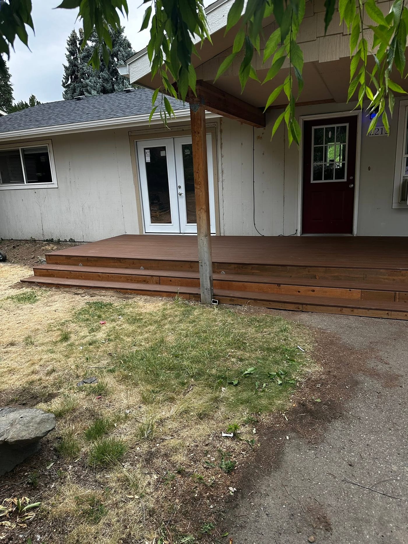 The finished landing deck and steps outside the French door