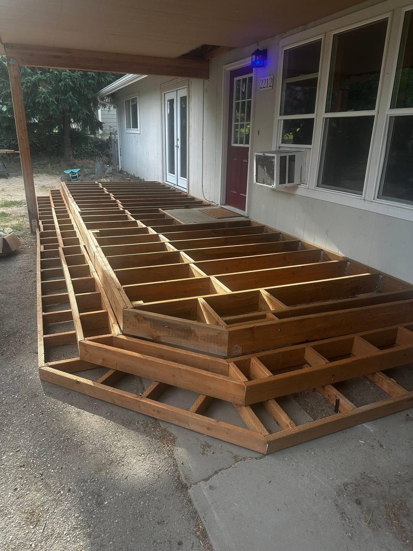 Joists and stair framing set for a covered deck before the boards went down